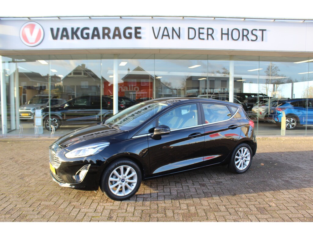 Ford Fiesta 1.0-100pk EcoBoost Titanium 5deurs Mooie en zuinige Ford Fiesta in de luxe Titanium uitvoering. Climate control , Cruise control , Navigatie , Bluetooth