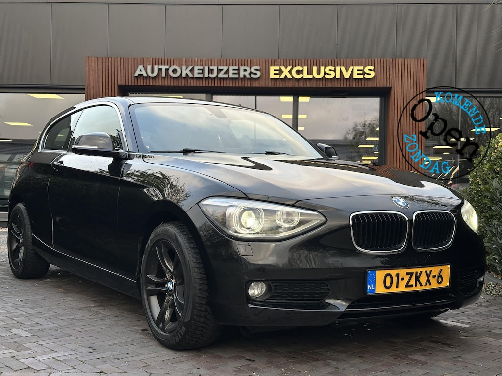 BMW 1-Serie 114i Business+ Leder Navi Parkeersensoren Mistlampen Cruise control 16"L.M.