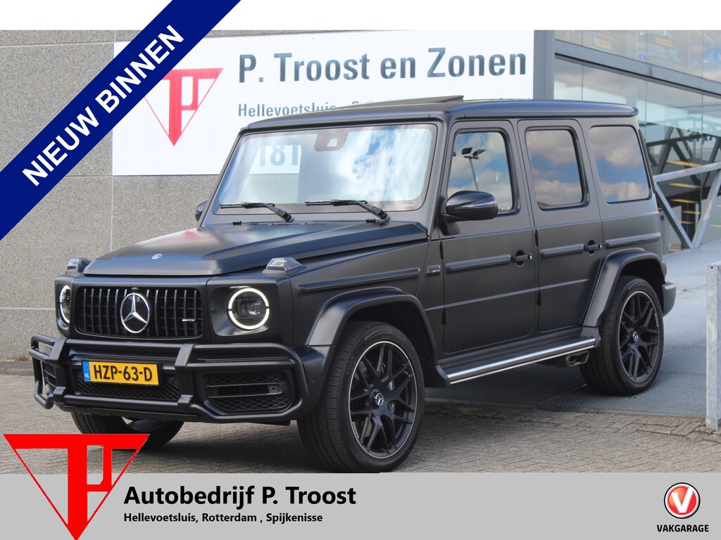 Mercedes-Benz G-klasse 63 AMG Manufaktur/Night pakket/Magno matt/Panoramadak/Burmester/Sfeerverlichting/Entertainment schermen/Akrapović/AMG active ride control/Elektrisch verstelbare stoelen met memory + massage/Stoel verwarming + koeling/360° camera/voorruitverwarming/IWC/Ala