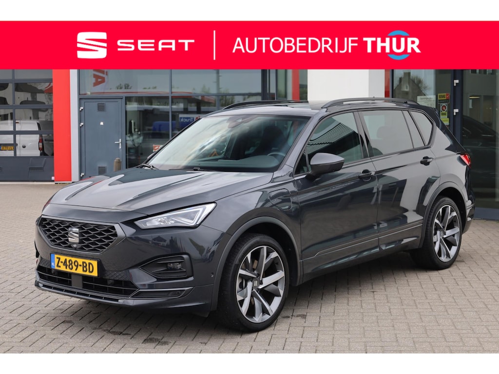 SEAT Tarraco 1.4 TSI e-Hybrid PHEV FR Business 245PK / 180kW DSG, NL auto door ons geleverd 1e eigenaar, 20" 'Supreme Cosmo Grey' LMV, 360 graden rondomzichtcamera (area view), panoramadak, elektrische achterklep met sensorsturing, winterpakket (verwarmbare stoelen), dodehoekdetectie (side assist), Apple Carplay & Android Auto, elektrisch verstel-, verwarm- en inklapbare buitenspiegels, draadloze telefoonlader etc.