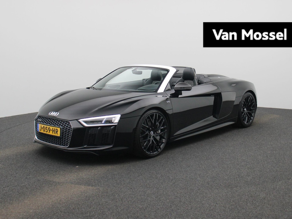 Audi R8 Spyder 5.2 FSI quattro 540 PK l Keramische remmen l Carbon interieur/exterieur l Bang & Olufsen Sound System l Uitlaatsysteem (met sound engineering) l Elektrisch bedienbare voorstoelen l Achteruitrijcamera l Apple Carplay | Android Auto
