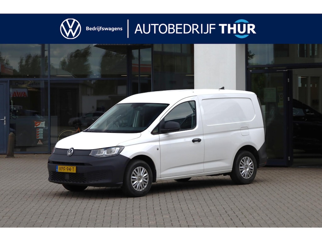 Volkswagen Caddy Cargo 2.0 TDI Economy Business 75PK / 55kW, NL auto door ons geleverd en onderhouden, trekhaak, parkeersensoren achter, radio, climatic airco, verstelbare buitenspiegels, schuifdeur rechts, achterdeuren met ruiten, laadvloer, scheidingswand etc.