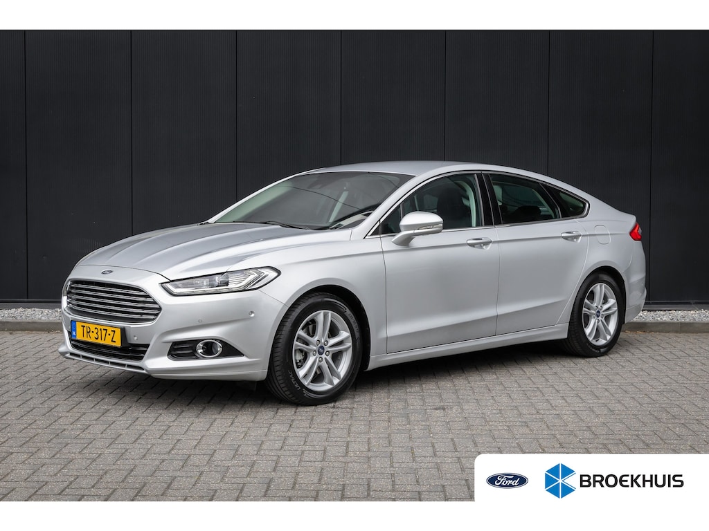 Ford Mondeo 1.5 165pk Titanium 5-deurs | 1 eigenaar | 100% dealer o.h. | NAP | 17 inch | Stoelverwarming | LED-verlichting | Privacy-glass | Elec. stoel incl memory | Keyless entry & start