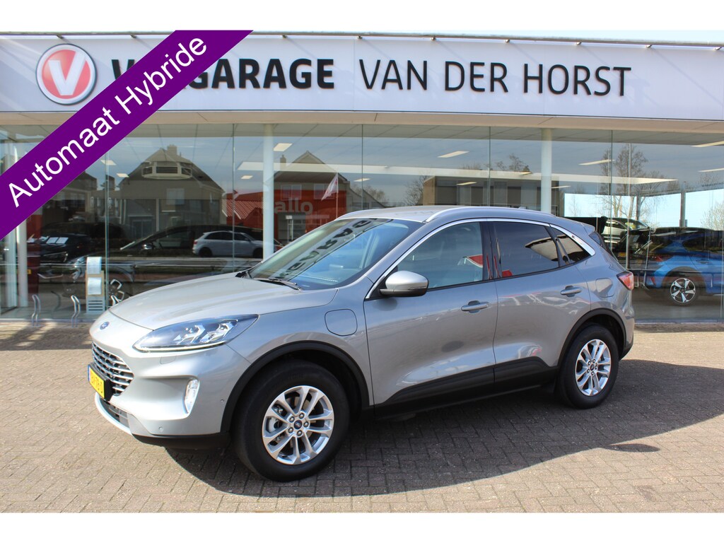 Ford Kuga 2.5-225 pk PHEV Titanium X Plug-in Hybrid. Hybride rijden voor een reëel bedrag ! Adapt. cruise cntrl, Autm. airco, Side- en lane assist, Stoel-, stuur-, voorraam- en achterbank verwarming, Camera v+a, LM wielen, metallic lak, navigatie, telefoonvoorb., B&O soundsyst. etc.