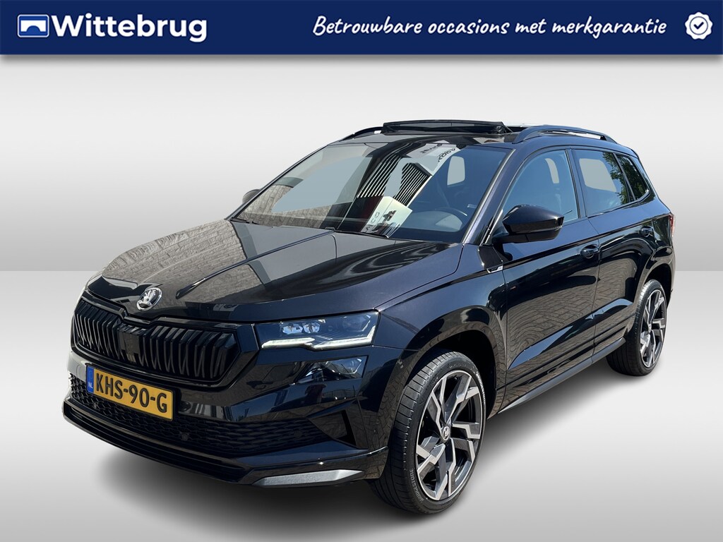 Skoda Karoq 1.5 TSI ACT Sportline / AUTOMAAT/ PANO/ TREKHAAK/ DCC/ STUUR+STOELVERWARM./ ACC/ PARK.SENSOR.V+A/ CAMERA/ SMARTLINK/ KEYLESS/ DIGITAL DASH/ NAVI/ DAB/ CLIMA/ LED/ 19'' LMV