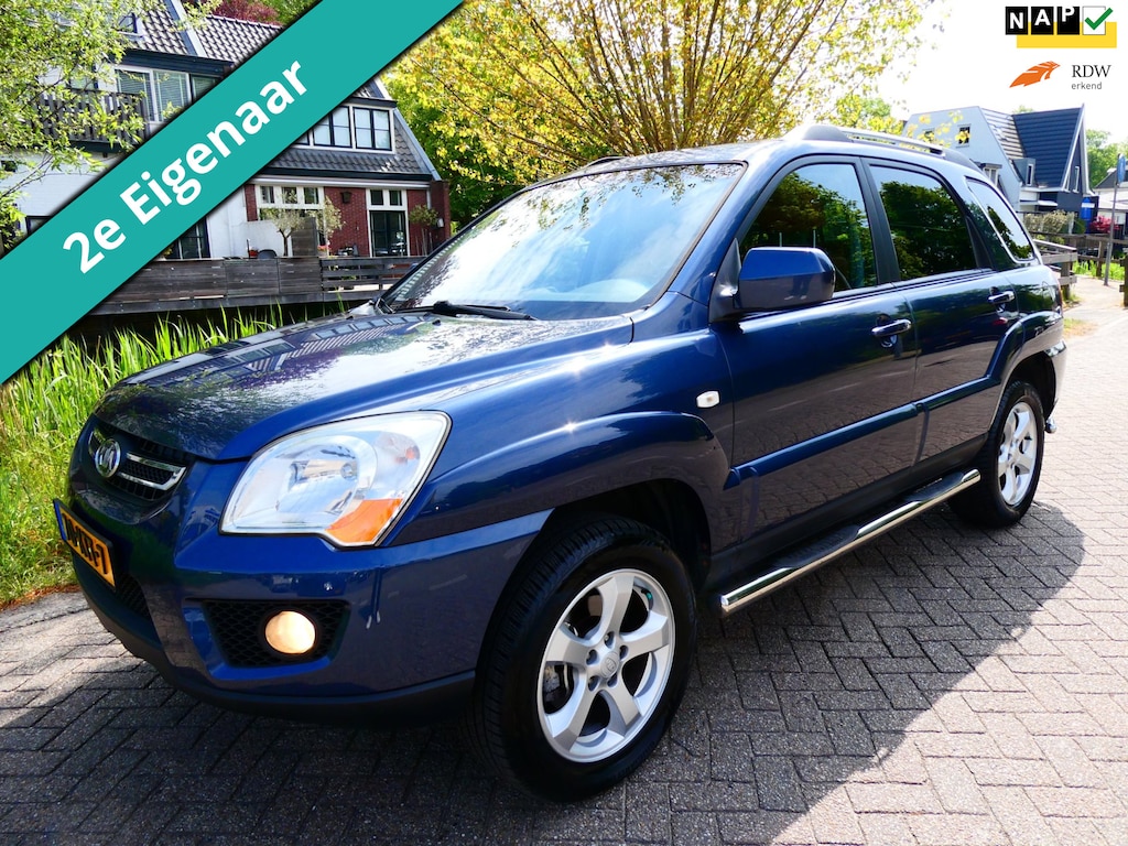 Kia Sportage 2.0 CVVT Fifteen 2e eig. Clima Cruise Kanteldak Trekhaak 1400kg.