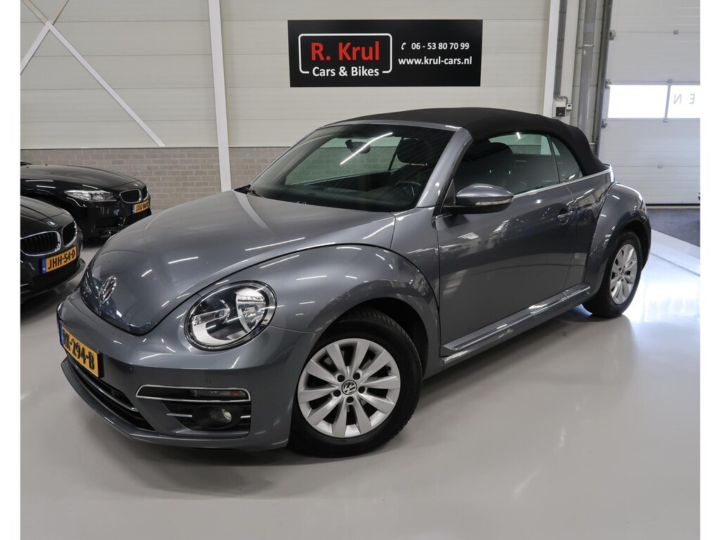 Volkswagen Beetle Cabriolet 1.2 TSI Design Airco-ecc Stoelverwarming Navigatie Sportvelgen PDC Windscherm Boekjes aanwezig Bluetooth Elektrische cabrioletkap Cruise control Metallic lak Nette staat