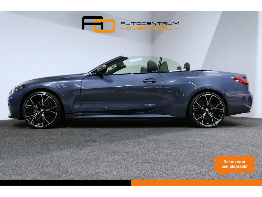 BMW 4-Serie Cabrio M440i xDrive High Executive / Air Collar (nekverwarming / BMW Laserlight / Elektr. verstelbare voorstoelen (links met memory) / Harman Kardon Surround Sound / Stoelverwarming / 20" / Rondomzichtcamera / HUD / Apple Carplay - Android Auto / Adaptief M onderstel / Elektr. wegklapbare trekhaak / Leder interieur / Dodehoekdetectie / Achteruitrijcamera