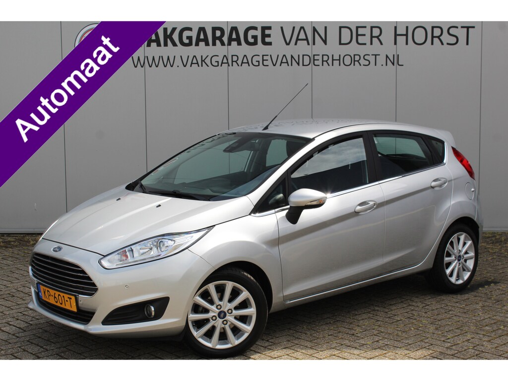 Ford Fiesta 1.0-100pk EcoBoost Titanium AUTOMAAT ! Gun u het gemak en comfort van een automaat ! Autm. airco, parkeersensoren v+a, metallic lak, cruise control, voorraamverwarming, navigatie, telefoonvoorb. etc.