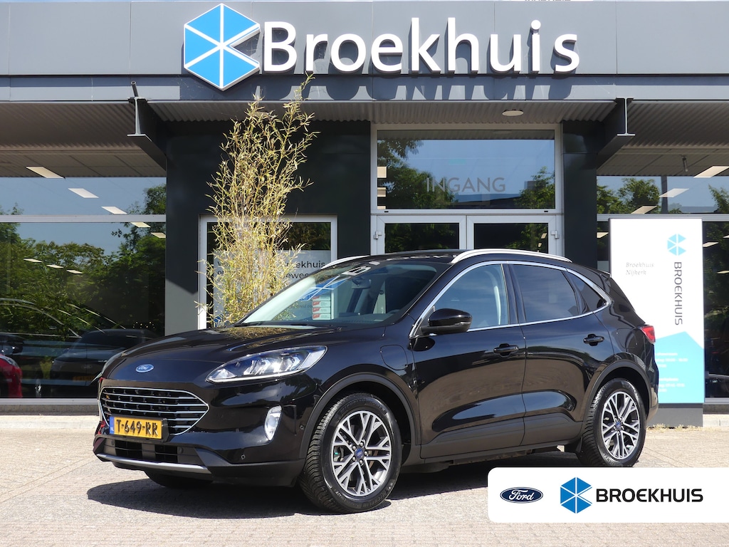 Ford Kuga 2.5 PHEV Titanium | CAMERA | ADAPTIVE CRUISE | DODEHOEKDETECTIE | STOEL+STUUR+VOORRUITVERWARMING | PARKEERSENSOREN V+A | ELEKTRISCHE ACHTERKLEP | LMV 18" | NAVI | APPLE CARPLAY / ANDRIOD AUTO |