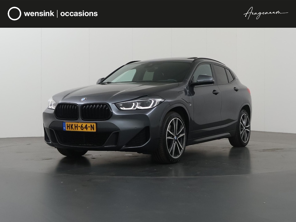 BMW X2 xDrive25e High Executive | M-Pakket | Panoramadak | Sportstoelen | HUD | M-Sportstoelen Elektrisch verstelbaar + Geheugen | Camera | Navigatie | DAB | Stoelverwarming | Ele. kofferdeksel |