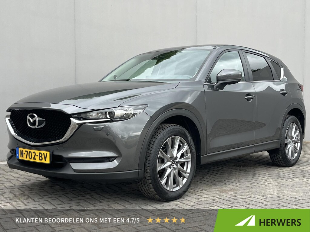 Mazda CX-5 2.0 SkyActiv-G 165 Comfort / Trekhaak (2.000KG) / Cruise Control / Lane Assist / Dode Hoek Detectie / Stuur-, Stoel Verwarming / Airco / Bluetooth / Full-Map Navigatie / Elektr-Bestuurderstoel Met Geheugen /