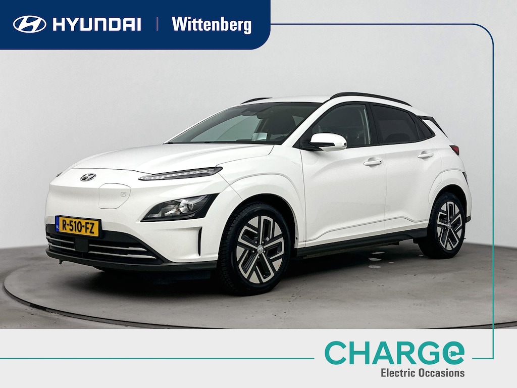 Hyundai Kona Electric EV FASHION 64 kWh *| SUMMERDEAL! | FACELIFT MODEL | SoH 93% | DODEHOEK DETECTIE | PDC | 3 FASEN | WARMTEPOMP | CAMERA | CLIMA | CRUISE ADAPT. | NAVI | PRIVACY GLASS | DAKRAILING | APPLE CAR PLAY & ADROID AUTO | ALL SEASONS |