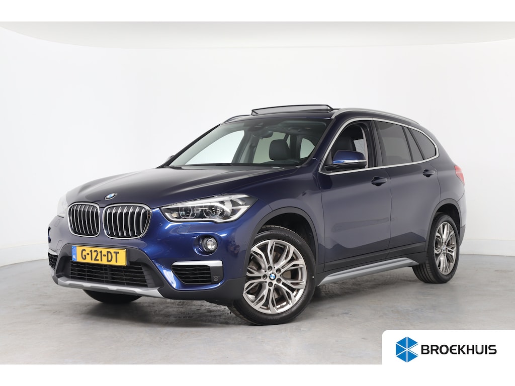 BMW X1 xDrive20i High Executive | Dealer Onderhouden! | Open Dak | Trekhaak | Sportstoelen | HUD | LED | Half Leder | Stoelverwarming | Cruise Control | Camera | Navi | Clima