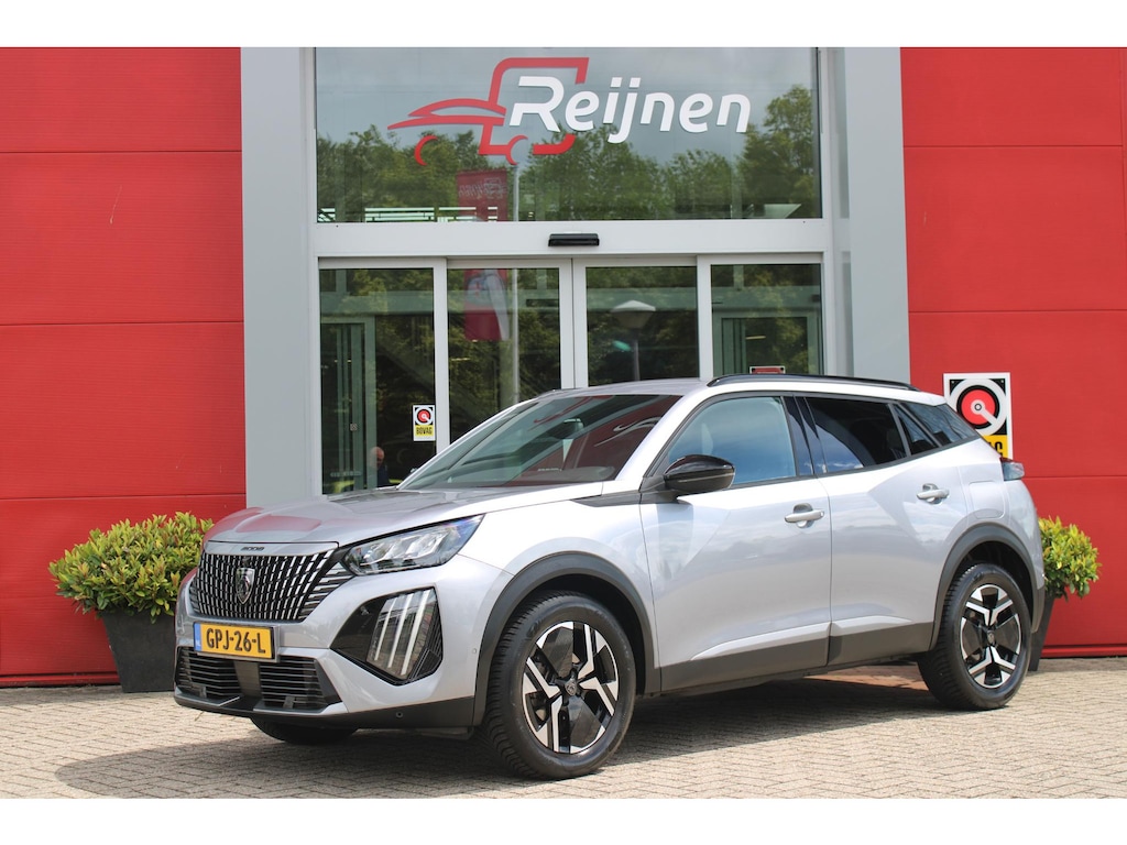 Peugeot 2008 1.2 100PK ALLURE | TREKHAAK | CAMERA VOOR + ACHTER | NAVIGATIE | DRAADLOZE APPLE CARPLAY/ANDROID AUTO | LED KOPLAMPEN | ALL SEASON BANDEN | ADAPTIVE CRUISE CONTROL | DODEHOEK DETECTIE | CLIMATE CONTROL | DAB+ RADIO |