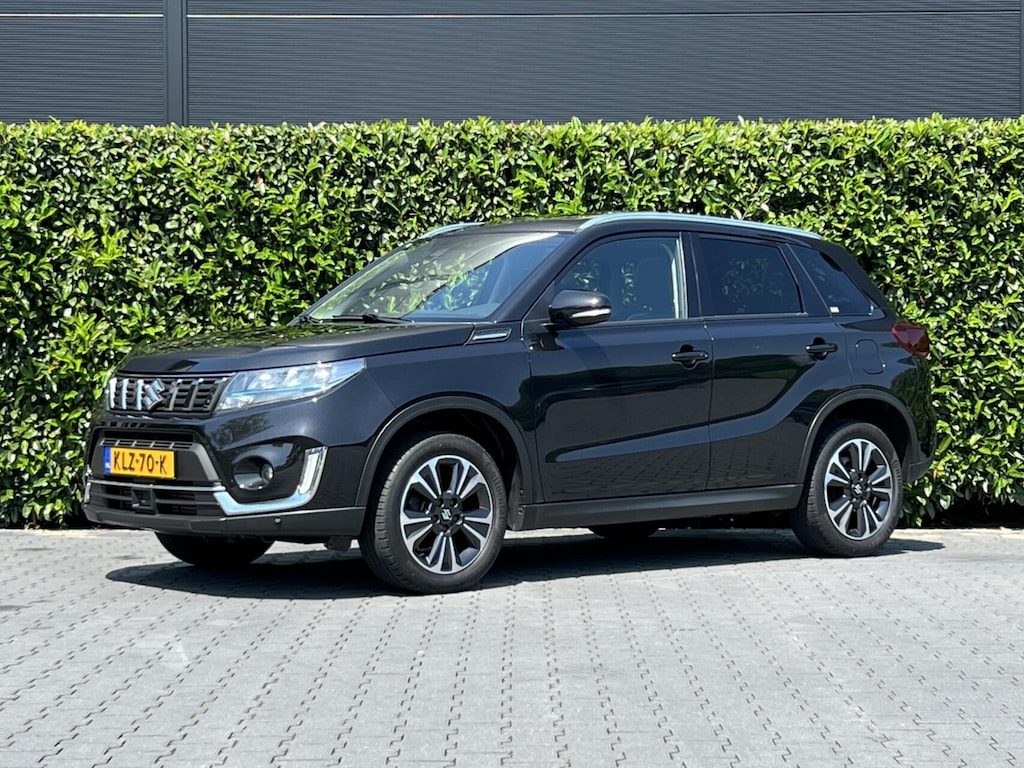 Suzuki Vitara 1.4 Boosterjet Style Smart Hybrid, FACELIFT, PANORAMADAK, LEDER/ALCANTARA, CAMERA, NAVIGATIE, ADAPT CRUISE CONTROL, CLIMATE CONTROL, STOELVERWARMING, DAB, LED, LICHTMETAAL 17"