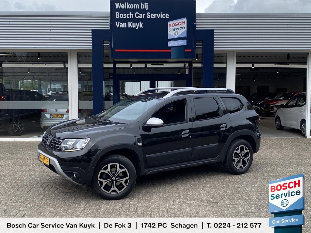 Dacia Duster 1.0 TCe Bi-Fuel Prestige / Apple-Carplay & Android-Auto / DAB / Navi / Camera / Airco / Cruise-Control / Getint Glas / ELKTR-Pakket / PDC Achter / LMV 17'' / Dakdragers / ENZ.