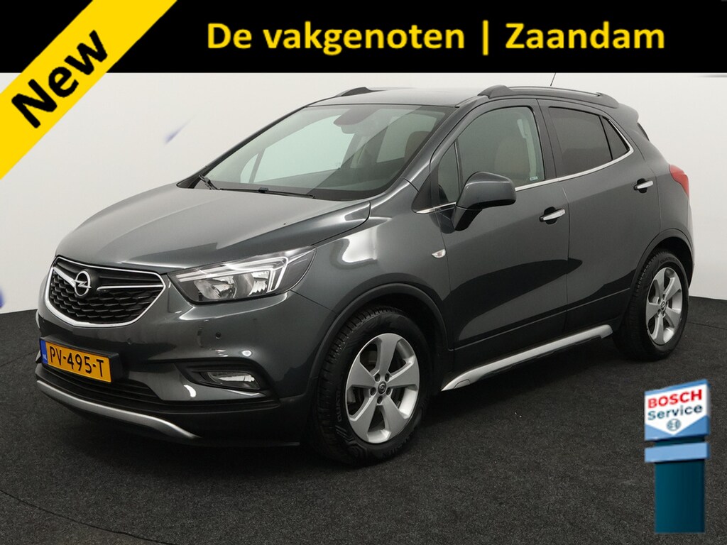 Opel Mokka X 1.4 Turbo Innovation Trekhaak, Apple Carplay/Android Auto, Parkeersensor voor/achter, Achteruitrijcamera, Voorstoelen verwarmd, Lederen bekleding, stuur verwarmd, Cruise control. Hoge instap, veel rijcomfort en een complete luxe uitvoering. . Een ideale gezinsauto met een luxe uitstraling en veel extra's.