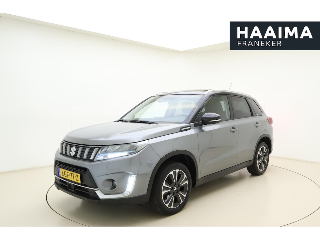 Suzuki Vitara 1.4 Boosterjet Style Smart Hybrid 129pk | Panoramadak | Trekhaak | Climate Control | Cruise Control Adaptief | Camera | Stoelverwarming | Navigatie | Parkeersensoren