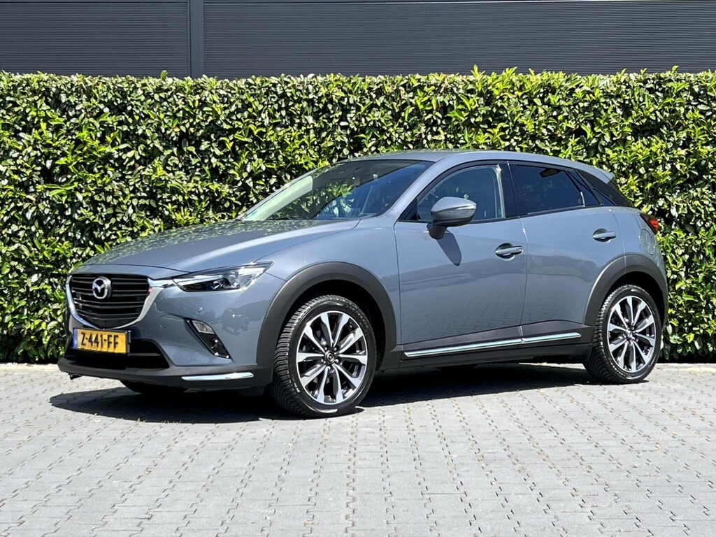 Mazda CX-3 2.0 SkyActiv-G 121 LUXURY, NAVIGATIE, CRUISE CONTROL, CLIMATE CONTROL, STOELVERWARMING, HALF LEDER, DODEHOEK, KEYLESS, HUD, LED, DAB, LICHTMETAAL 18"