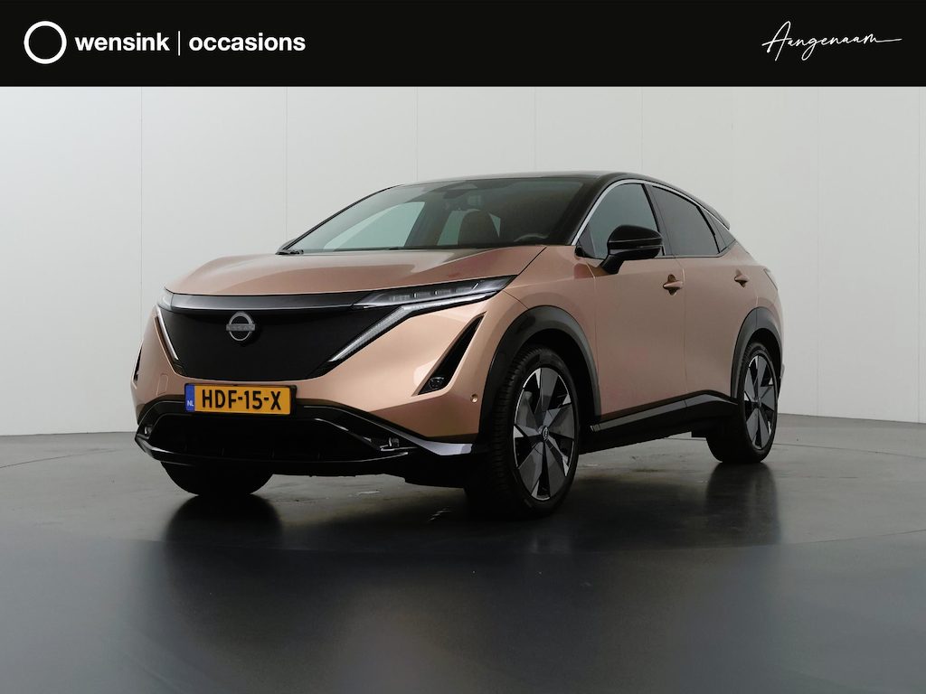 Nissan Ariya Advanced Plus 91 kWh | SOH 99% | Trekhaak | Elektrisch verstelbare stoelen + Geheugen | BOSE audio | Stoelverwarming voor + achter | Navigatie | 360 Camera | DAB | Apple CarPlay/Android Auto | Stuurverwarming | Panoramadak | HUD | Adaptieve Cruise Control | Ele. kofferdeksel |