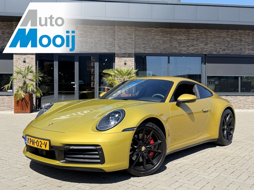 Porsche 992 911 3.0 Carrera S / 450 PK / Paint to Sample / PTS Yellow Storm / 18-way Seats / BOSE / Race-Tex / Alcantara / ACC / Sportuitlaat