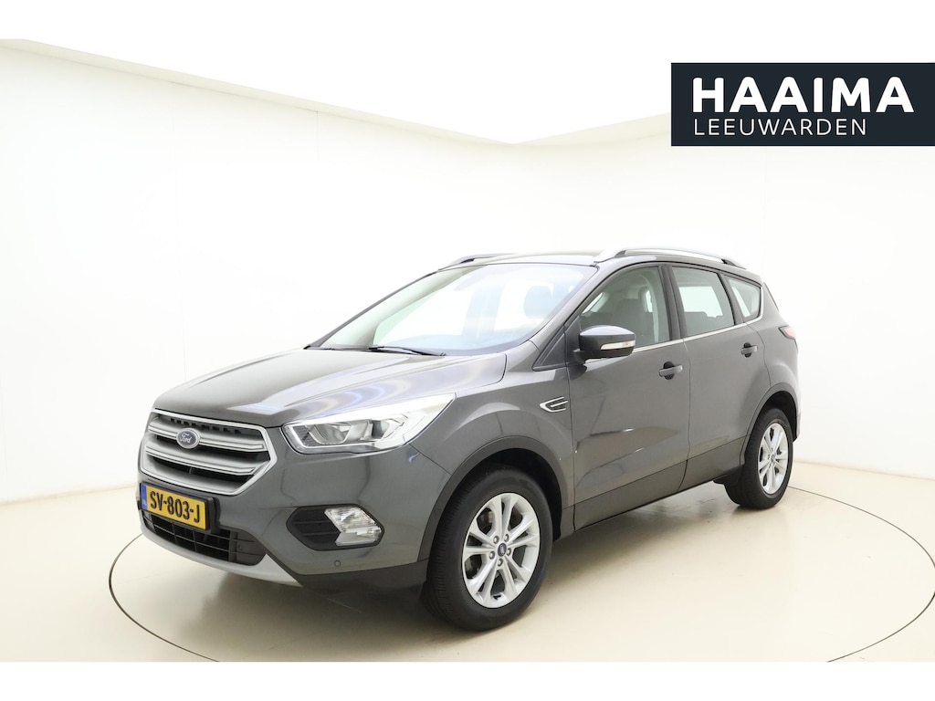 Ford Kuga 1.5 EcoBoost Titanium | Trekhaak | Achteruitrijcamera | Airco | Navigatie | Elektrische achterklep | Cruise control | Start/Stop bediening | Climate control | Parkeersensoren | Lederen/stof interieur | Stuurbediening