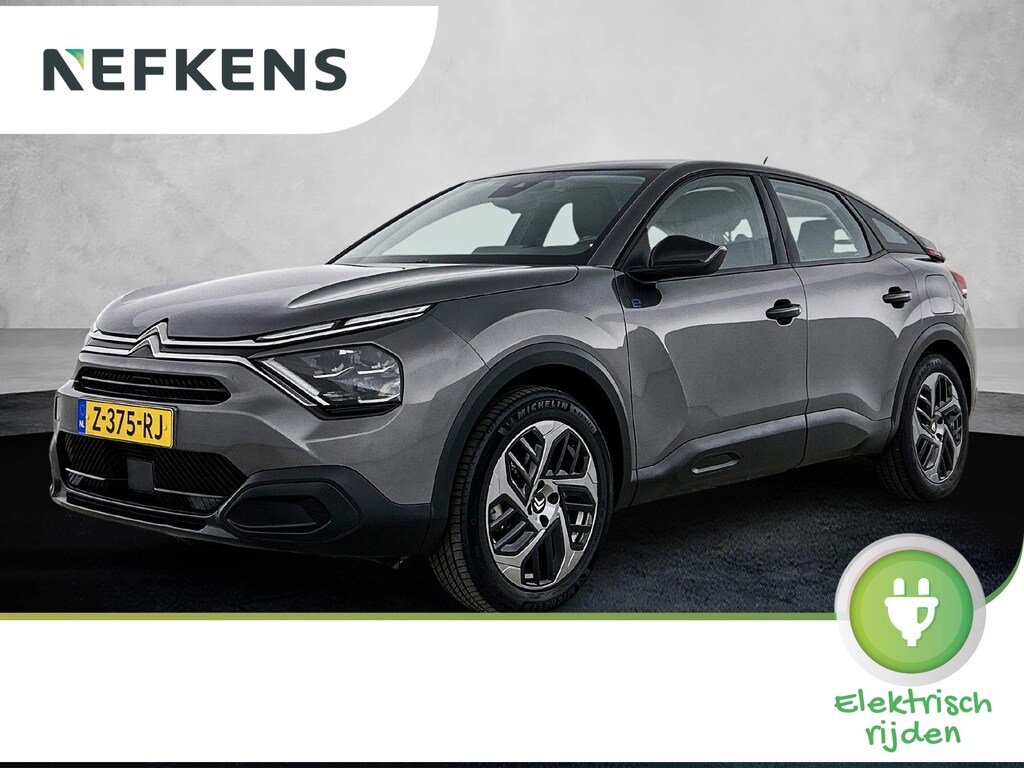 Citroën E-C4 You 50 kWh 136pk | Accu 96% | Navigatie via Apple Carplay / Android Auto | Achteruitrijcamera | Climate Control | Cruise Control | Parkeersensoren | DAB+ radio | Armsteun | Stof/kunstlederen comfortstoelen | Volledig digitaal instrumentenpaneel | Adaptief demping systeem | 18” lichtmetalen velgen |