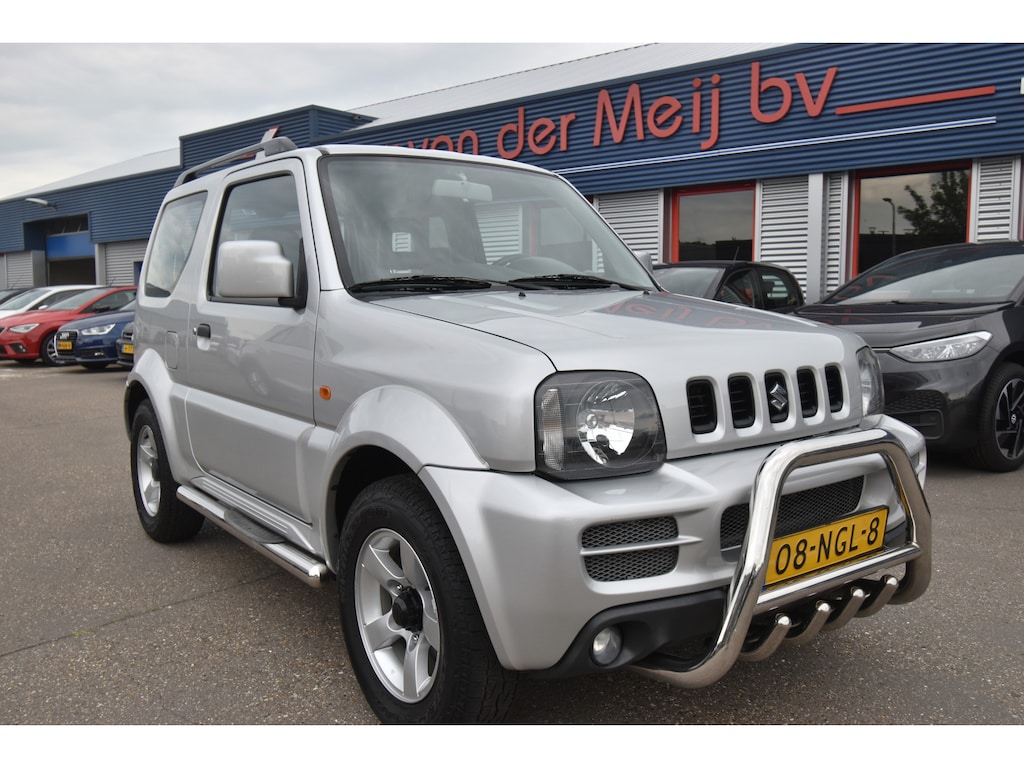 Suzuki Jimny 1.3 Exclusive 4WD , TREKHAAK , AIRCO , LMV15 , RCD SPELER , ZIJ BARS ,FRONT GARD ,