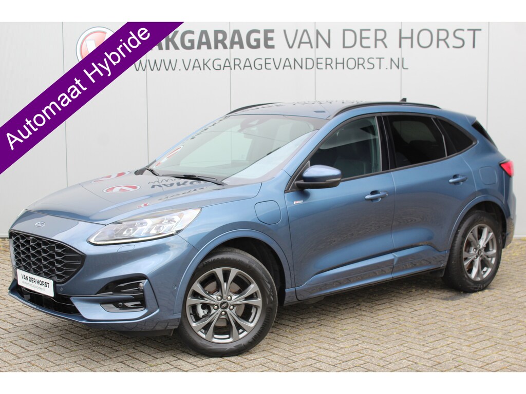 Ford Kuga 2.5-225pk PHEV ST-Line X. Hybride rijden voor een reële prijs ! Camera v+a, LED verl., autm. airco dual, adapt. cruise cntrl, B&O soundsyst., stoel- en voorraamverw., keyless entry & start, elektr. achterklep, navigatie, telefoonvoorb. etc.