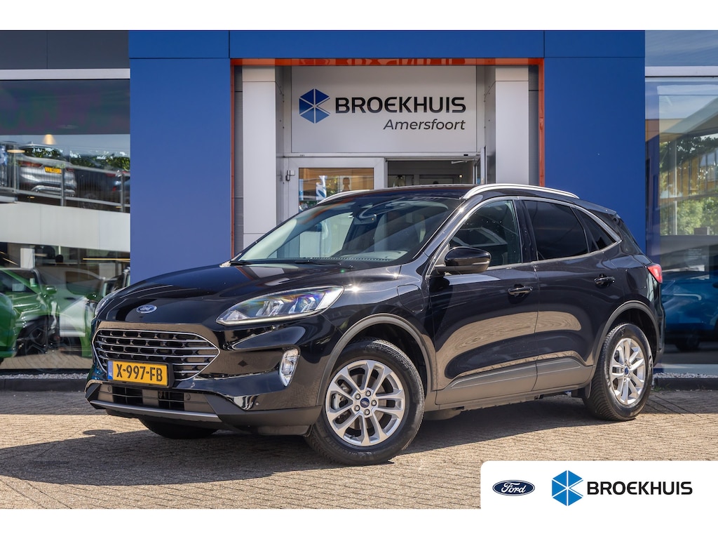 Ford Kuga 2.5 PHEV Titanium | Trekhaak | Keyless entry/Start | Achteruitrijcamera | Stoel/Stuurwiel Verwarming | Navigatiesysteem full map | Achteruitrijcamera | Airco (automatisch) | Keyless entry