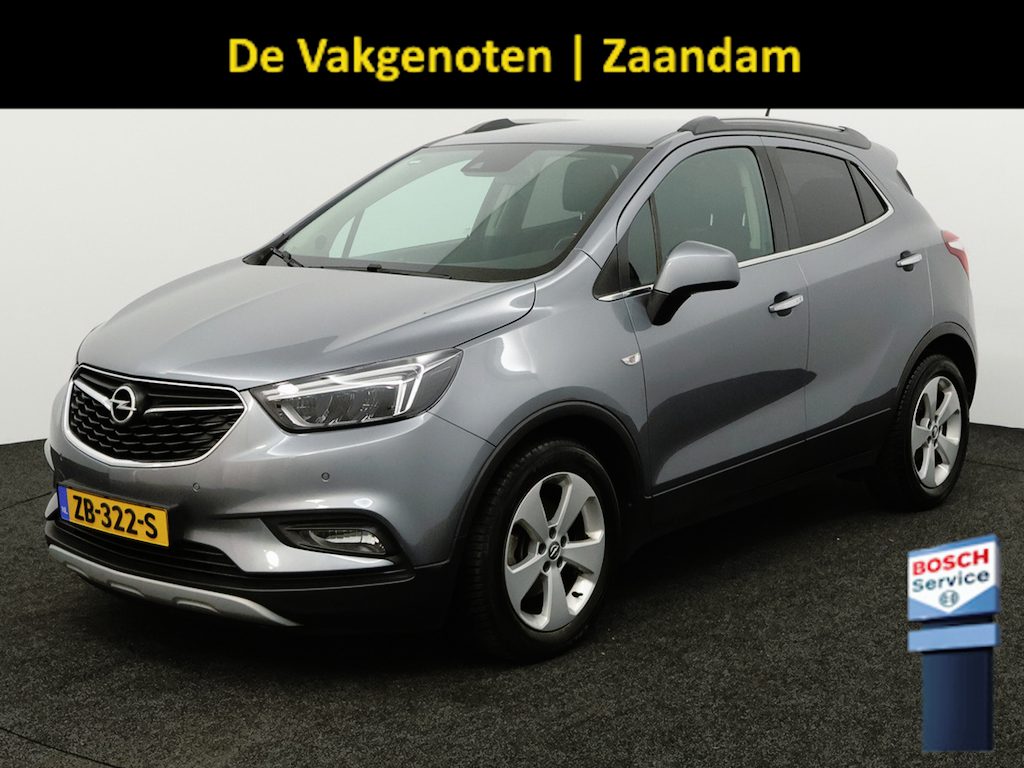 Opel Mokka X 1.4 Turbo Innovation trekhaak, airco, cruisecontr, electr stoel, Apple Carplay/Android Auto, Achteruitrijcamera, Parkeersensor voor/achter De Opel Mokka X 1.4 Turbo Innovation is een ruime en luxe SUV die comfort en stijl perfect combineert. Dankzij de krachtige en soepele turbomotor biedt deze auto een prettige rijervaring, ter