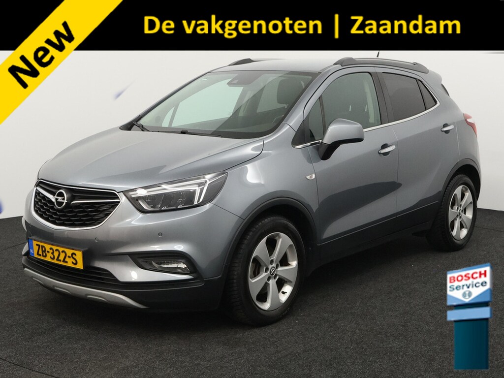 Opel Mokka X 1.4 Turbo Innovation trekhaak, airco, cruisecontr, electr stoel, Apple Carplay/Android Auto, Achteruitrijcamera, Parkeersensor voor/achter De Opel Mokka X 1.4 Turbo Innovation is een ruime en luxe SUV die comfort en stijl perfect combineert. Dankzij de krachtige en soepele turbomotor biedt deze auto een prettige rijervaring, ter
