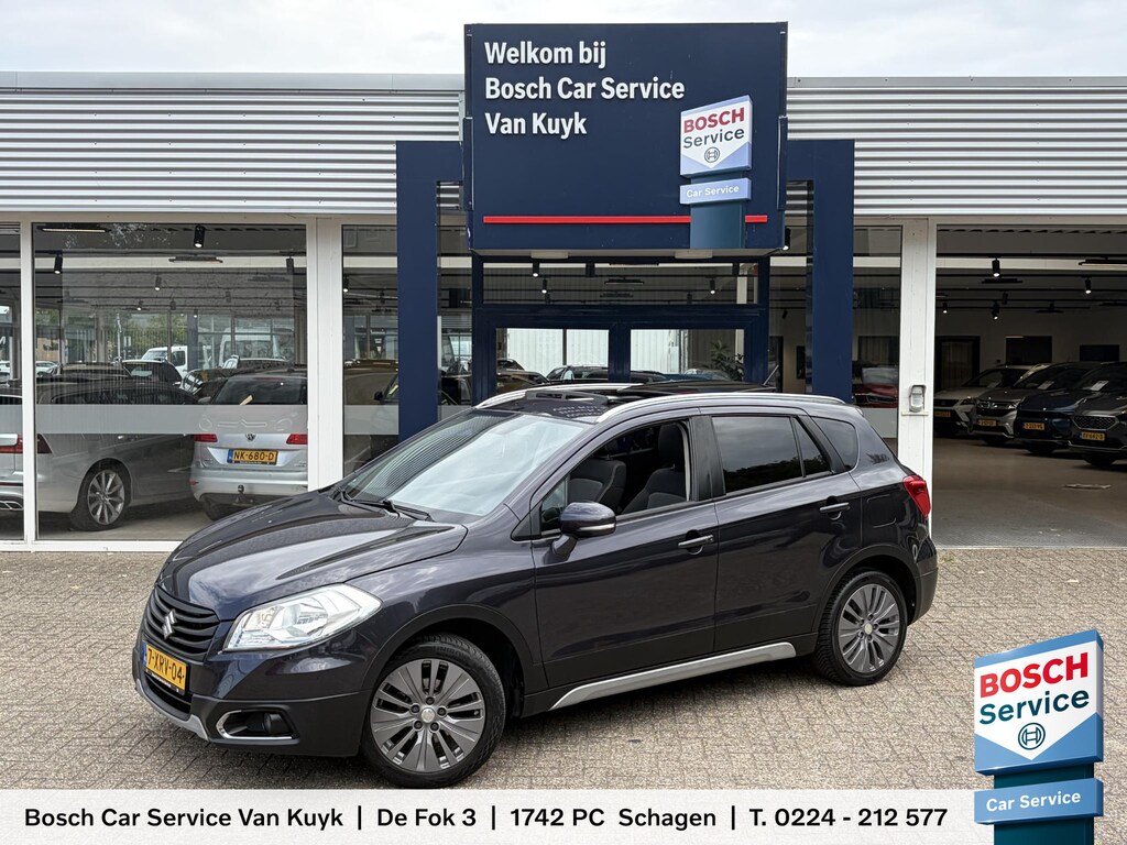 Suzuki S-Cross SX4 1.6 Exclusive / NL-Auto / Open-Panodak / Stoelverwarming / Cruise-Control / Climate-Control / Radio-Bluetooth / Elektr.-Ramen V+A / 18'' LMV / All-Season / ENZ.