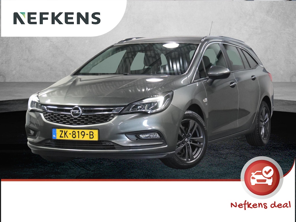 Opel Astra ST 105PK 120 Jaar Edition | 1ste eigenaar | Camera | Trekhaak | AppleCarPlay/Android | Armsteun | AGR stoelen | Navigatie | Climate Control | Cruise Control | Isofix | Privacy Glass | Parkeersensoren |