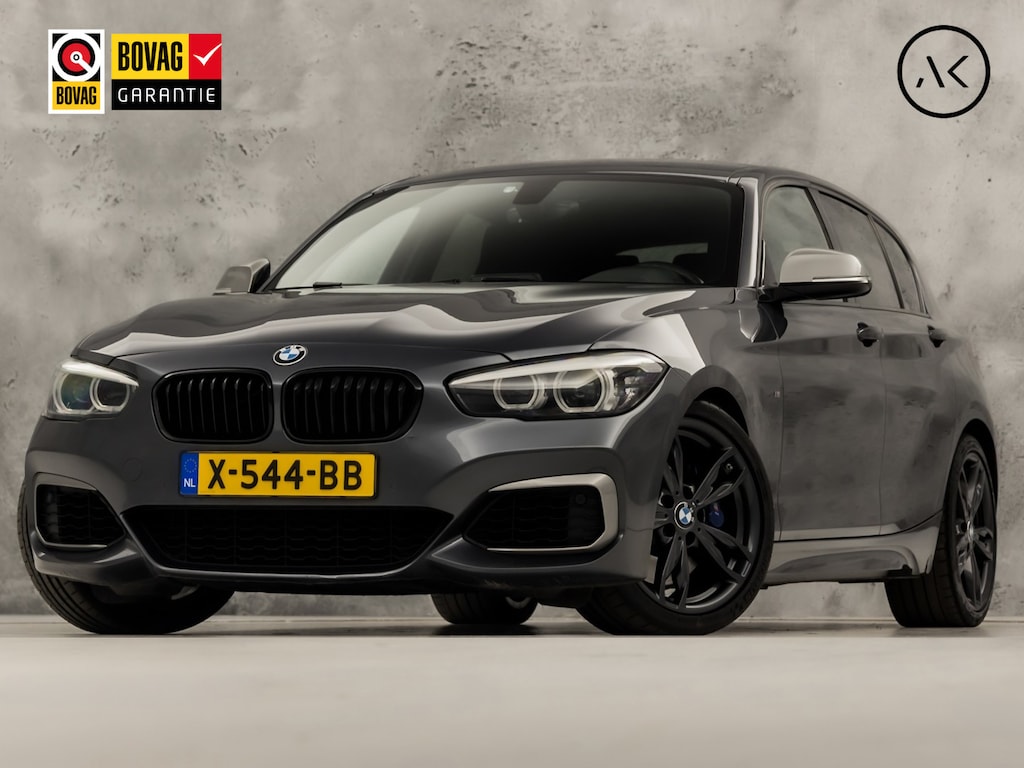 BMW 1-Serie M140i M Sport High Executive 340Pk Automaat (6 CILINDER, M PAKKET, HARMAN/KARDON, ALCANTARA, CAMERA, SPORTSTOELEN, M SPORTREMMEN, NAVIGATIE, STOELVERWARMING, GETINT GLAS, NIEUWSTAAT)