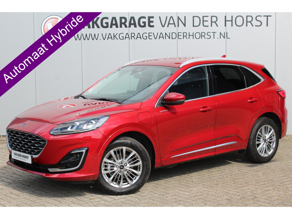 Ford Kuga 2.5-225pk PHEV 'Vignale'. Zeer luxe hybride rijden voor een reële prijs ! Slechts 33.000km ! Autm.airco dual, stuur-, stoel-, achterbank- en voorraamverw., LED verl., lederen interieur, B&O soundsyst., lane- en side assist etc.