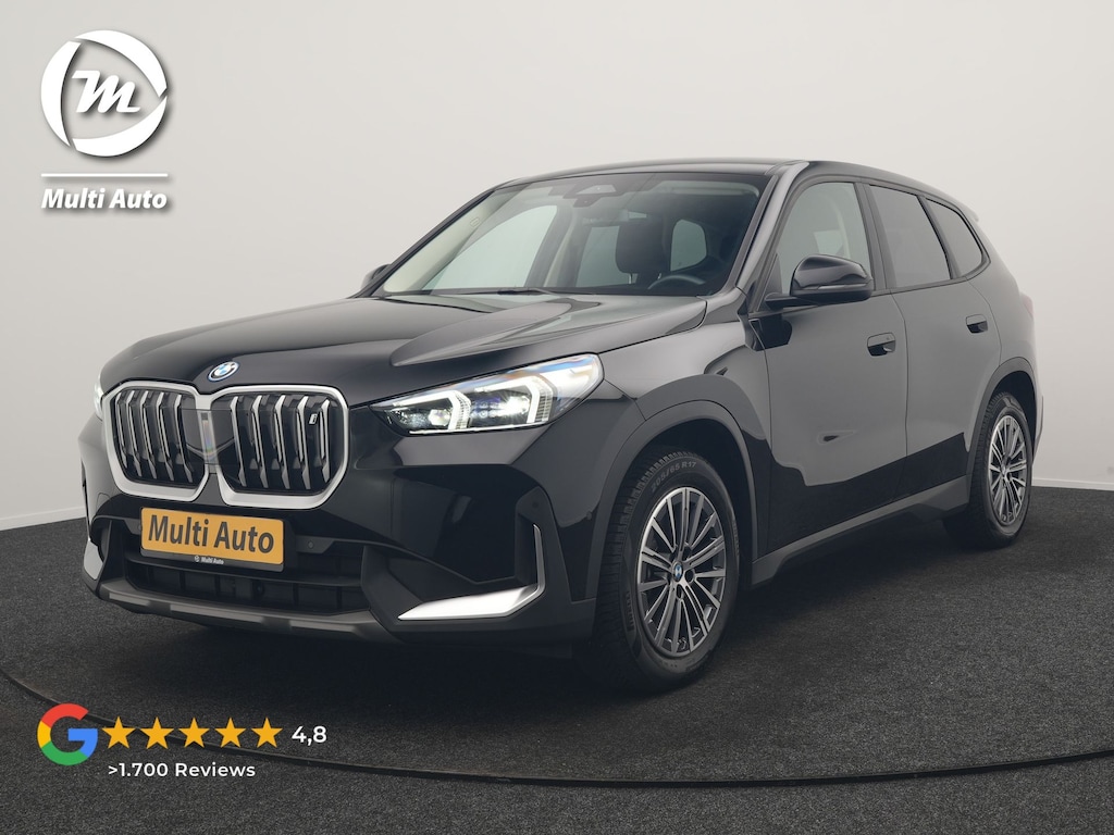 BMW iX1 xDrive30 67 kWh 313pk Dealer O.H. | Trekhaak Af Fabriek | Camera | Adaptief M Onderstel | Voorstoelen Verwarmd | Keyless | Sfeerverlichting | Apple Carplay | Adaptive LED | Cruise Control | Navigatie | DAB |