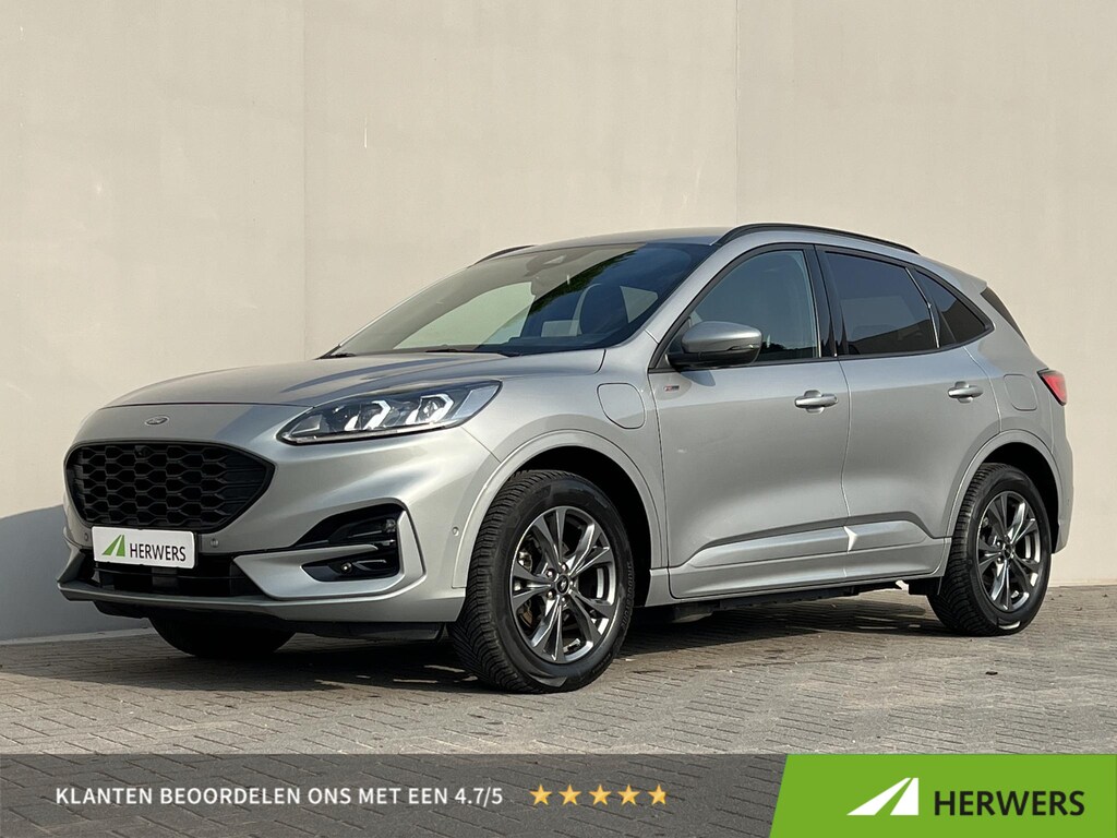 Ford Kuga 2.5 PHEV ST-Line / Dealer onderhouden / All season / 1.500 kg trekgewicht / Navigatie / Stuur-, stoel- en achterbank verwarming / HUD / Camera / 18" LM wielen