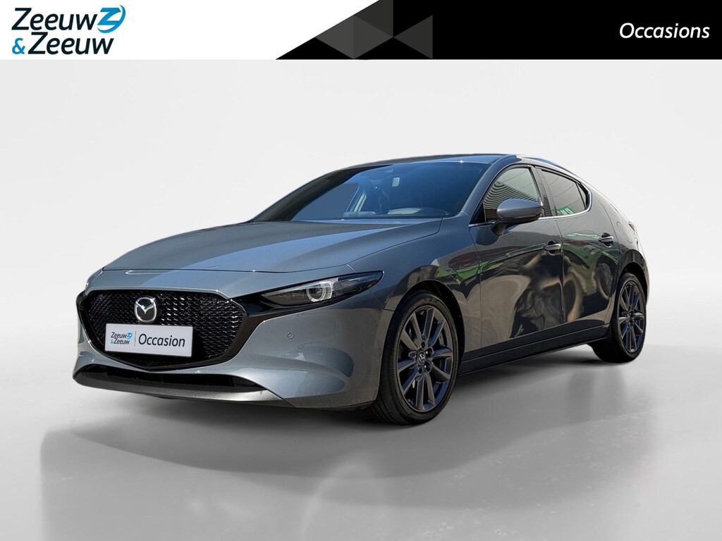 Mazda 3 2.0 e-SkyActiv-G M Hybrid 122 Comfort met Bose | Apple Carplay / Android Auto | Navigatiesysteem | Licht + Regensensor | Elektrisch Verstelbare Bestuurderstoel  | Stoel + Stuurverwarming | Parkeersensoren Voor + Achter | Camera Achter | 18"Lichtmetalen velgen | Lederen Bekleding | Cruise Control Adaptief