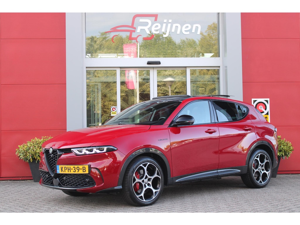 Alfa Romeo Tonale 1.5T 160PK Hybrid Veloce TECHNOLOGY PACK: PARKEERWAARSCHUWING VOOR EN ACHTER/360° CAMERA / AUTONOMOUS DRIVING LEVEL 2: ADAPTIVE CRUISE CONTROL/LANE CENTERING ASSIST/TRAFFIC JAM ASSIST DODEHOEK DETECTIE AUTOMATISCH DIMMENDE BUITENSPIEGELS ELEKTRISCH BEDIENBARE ACHTERKLEP | 19" LICHTMETALEN VELGEN | DRAADLOZE TELEFOONLADER | NAVIGATIE | DRAADLOZE APPLE CARPLAY/ANDROID AUTO | FULL LED MATRIX KOPLAMPEN |