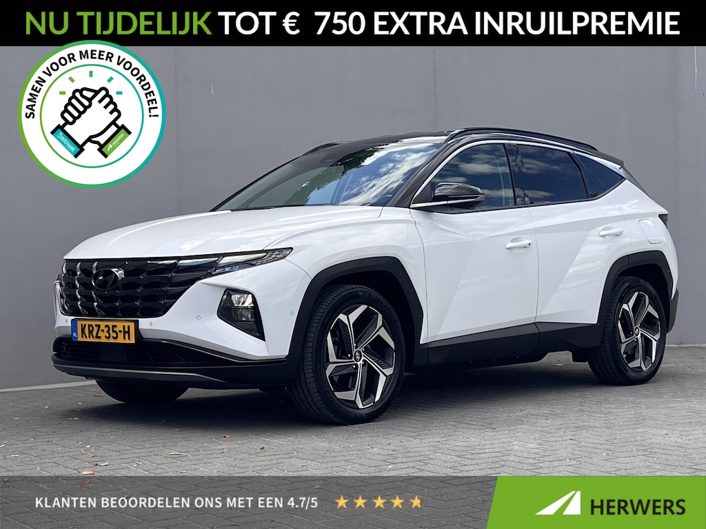 Hyundai Tucson 1.6 T-GDI PHEV Premium 4WD / Dealer onderhouden / Accu SoH 100 %/ 1.350 kg trekgewicht / Leder / Navigatie / Electr. stoelen & klep / Stoelventilatie / Stuur-, stoel- & achterbankverwarming / 19" LM wielen /