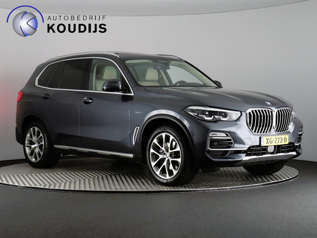 BMW X5 xDrive40i High Executive (NL-Auto / Skylounge / Luchtvering / 4Wiel sturing / 3D Camera / Stoelverw. + Koeling / Softclose / H&K / Vol!)