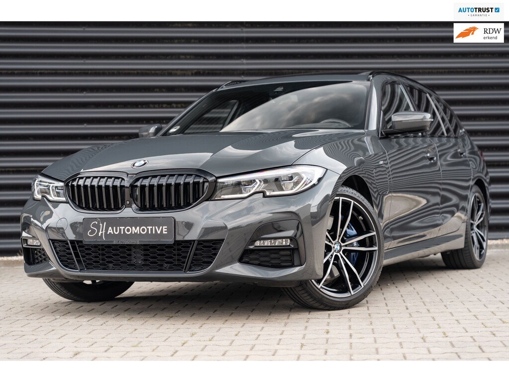 BMW 3-Serie Touring 330e High Executive M Sport / DRAVIT GRAU / PANO / 360 CAMERA / HUD / CARBON / TREKHAAK
