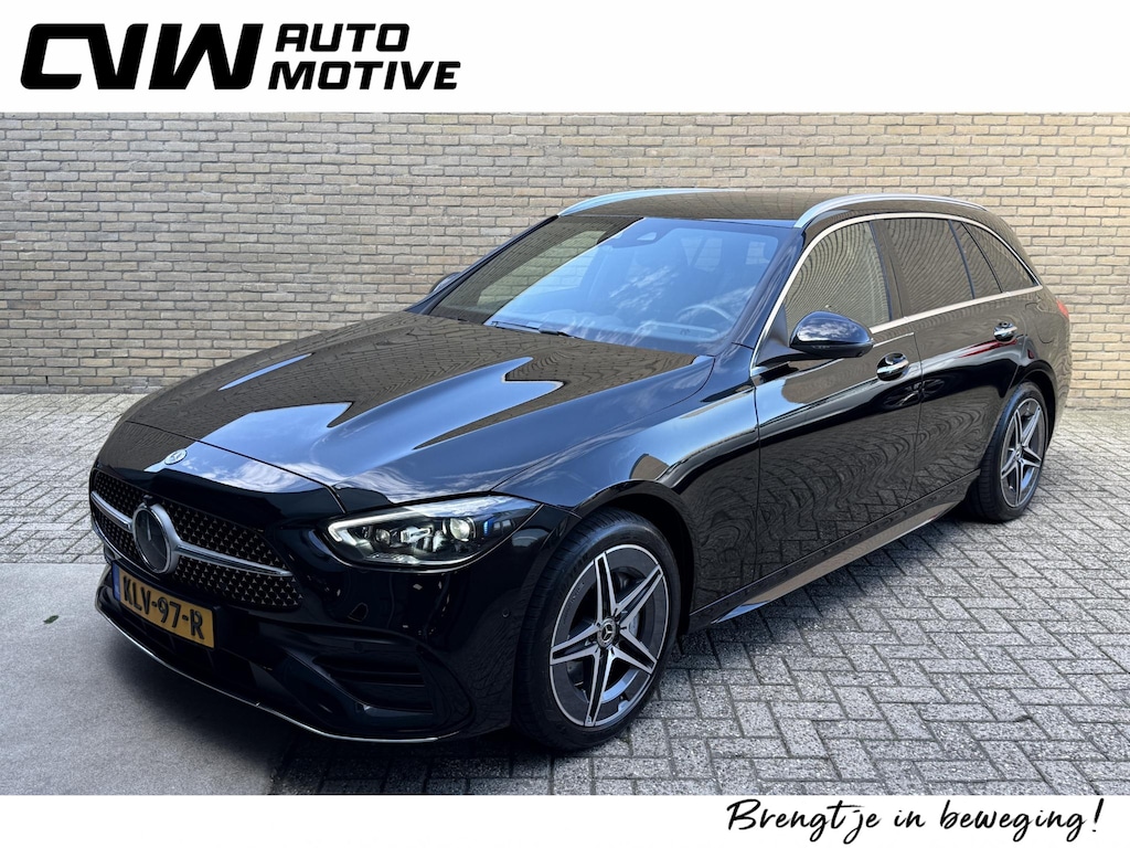 Mercedes-Benz C-klasse 300 e AMG Line | Sfeerverlichting | Half leder | 360 camera | Navigatie | Apple CarPlay | Stoelverwarming | Dodehoekdetectie | 18 inch AMG velgen | LED | DAB | Keyless | Elektrische achterklep | Volledig onderhouden