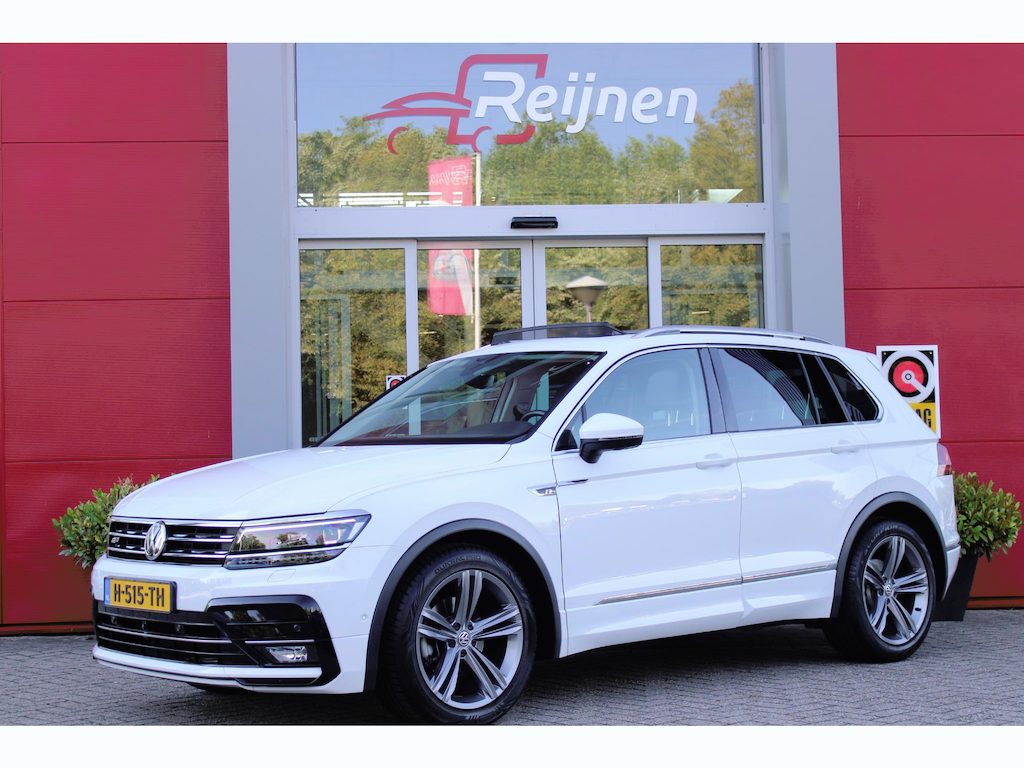 Volkswagen Tiguan 1.5 TSI 150PK AUTOMAAT HIGHLINE BUSINESS R | PANORAMA SCHUIF/KANTEL DAK | LEDEREN BEKLEDING | BESTUUDERSSTOEL ELEKTRISCH VERSTELBAAR MET GEHEUGENFUNCTIE | ELEKTRISCH WEGKLAPBARE TREKHAAK | IQ LIGHT KOPLAMPEN | VIRTUAL DISPLAY | DRAADLOZE APPLE CARPLAY/ANDROID AUTO | NAVIGATIE | 19" LICHTMETALEN VELGEN | ELEKTRISCH BEDIENBARE ACHTERKLEP | GETINTE ACHTERRUITEN | CAMERA VOOR + ACHTER | PARKEERSENSOREN VOOR + ACHTER | STOEL VERWARMING |