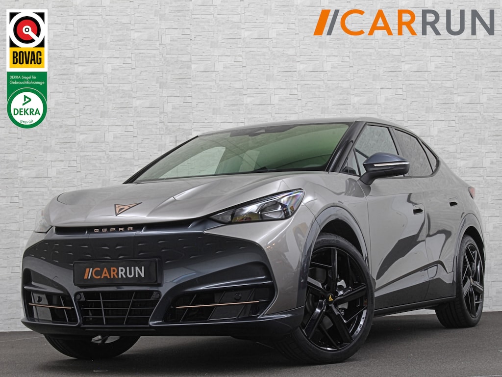 CUPRA Tavascan 286pk 77 kWh | Nieuw! | Winter-Pack | Warmtepomp | Verlengde Fabrieksgarantie | 7x Op Voorraad | Adaptive Cruise Control | 3-Zone Clima | Verwarmde Voorruit | Keyless-Entry | Sfeerverlichting | Stoelverwarming | Carplay | Stuurverwarming | Getint Glas | 19 inch | Lane-Assist | Camera | Draadloos Laden |