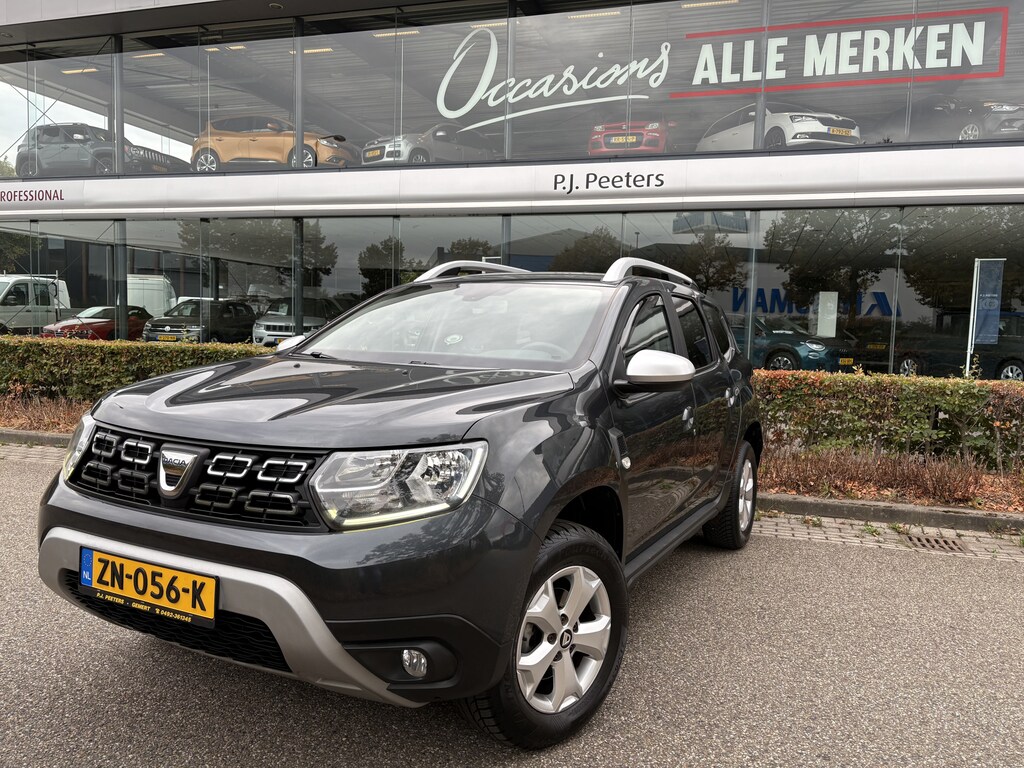 Dacia Duster 1.2 TCe Comfort Achteruitrijcamera - Airco - Navigatie - Trekhaak - Cruise control - Dakrails - Radio - Mistlampen voor - Start/stop systeem - Led verlichting - Elektrische ramen - Stuur multifunctioneel - Centrale vergrendeling met afstandsbediening - Bluetooth