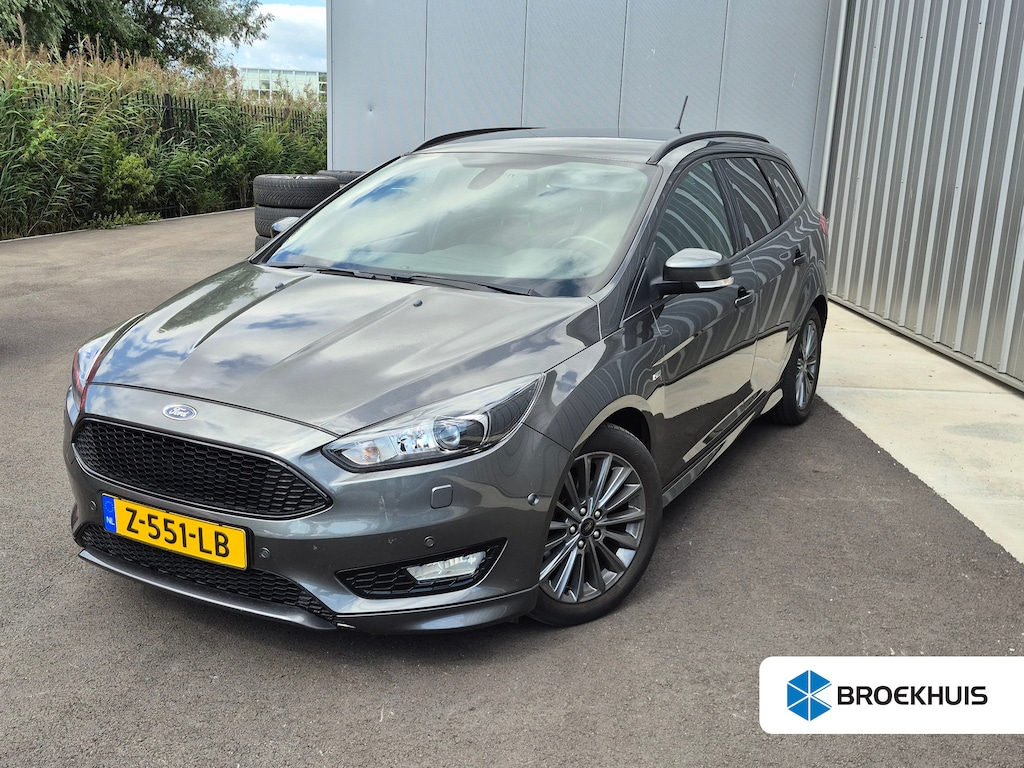 Ford Focus Wagon 1.0 ST-Line | Climate control | Cruise control | Navi | Stoel/stuur/voorruit verwarming | Parkeer assistent | Parkeersensoren | LED | 17"LMV