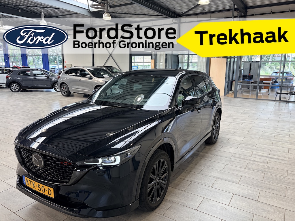 Mazda CX-5 2.0 SkyActiv-G 165pk Homura | Trekhaak | 19" | 360° camera | Bose | LED | Half leer | El. a. klep | Adapt. cruise | Stoel- en stuurverw.